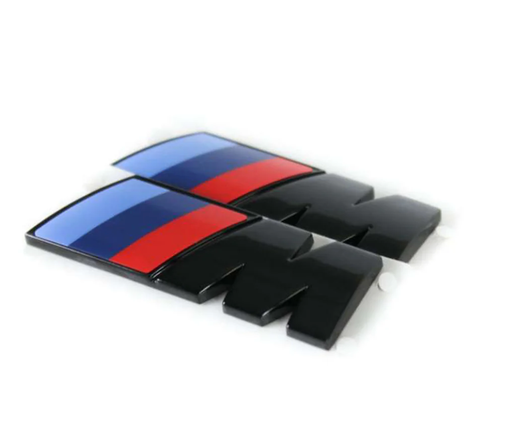 LOT DE 2 BADGES LATÉRAUX D'AILE BMW SÉRIE G « M » EN NOIR BRILLANT (55 MM X 20 MM)